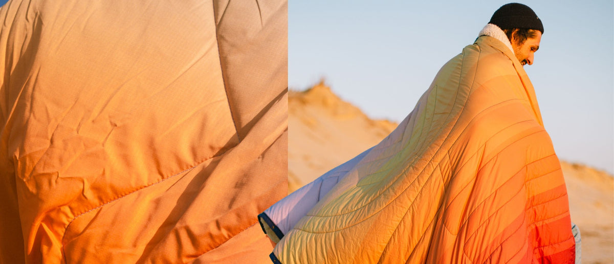 CloudTouch® Blanket – gesteppte Decke mit weißem Sherpa-Kragen und Farbverlauf von Orange zu Blau-Violett